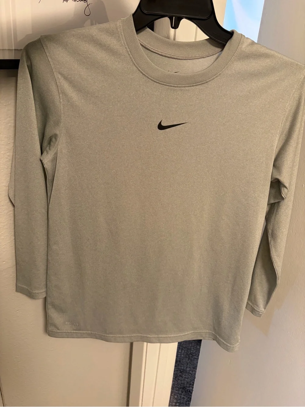 Nike Light Gray Long Sleeve Athletic Top with Black Swoosh